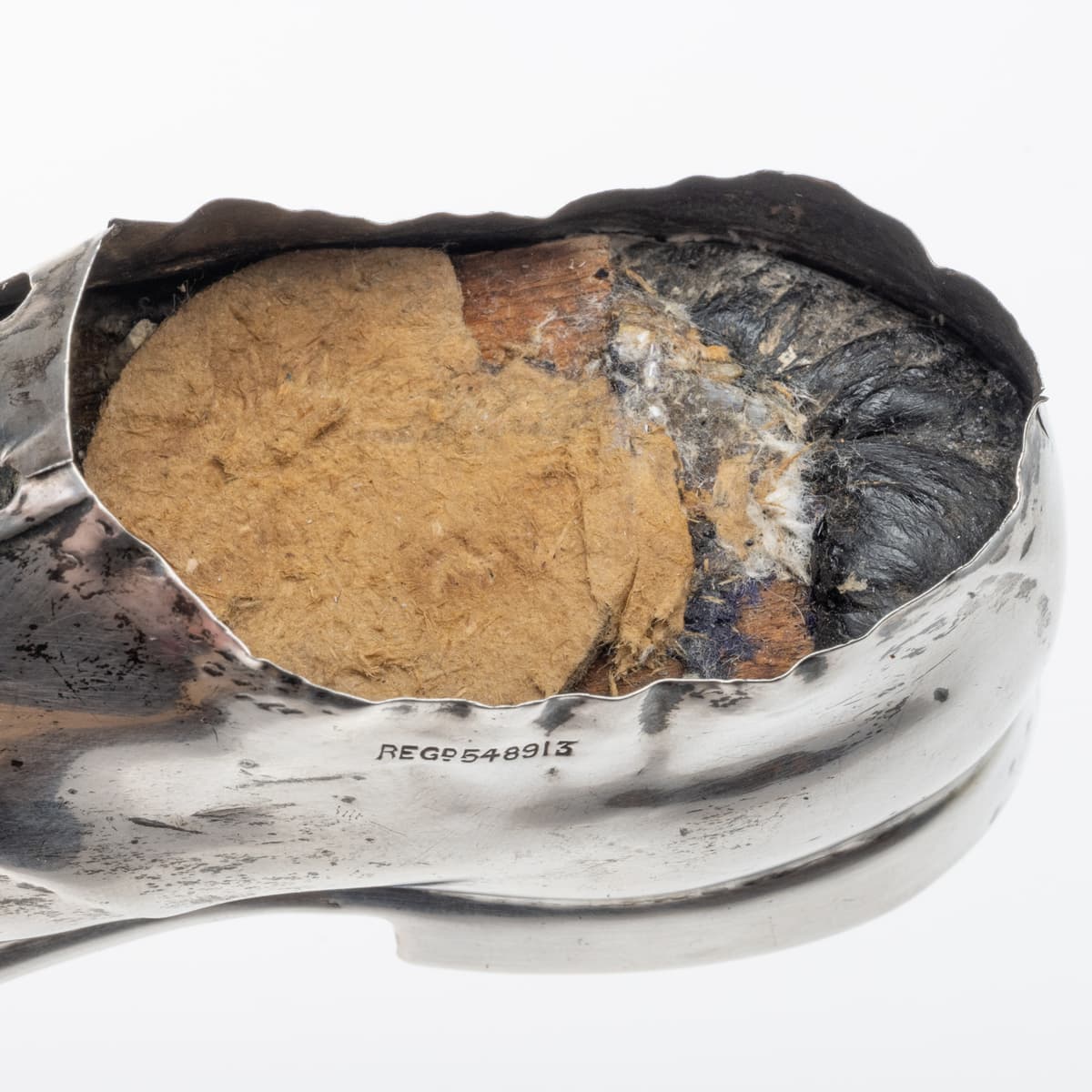 Inside Antique sterling silver pin cushion in the form of a gentleman’s shoe, hallmarked Chester c.1909, made by S. Blanckensee & Son Ltd with registered design number 548913