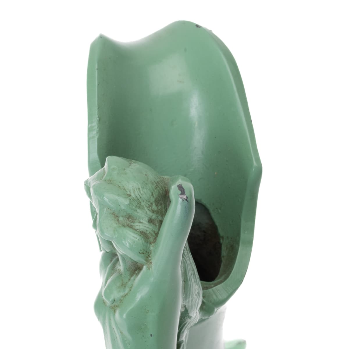 Close-up of female figure handle with swan motif on decorative ewer.