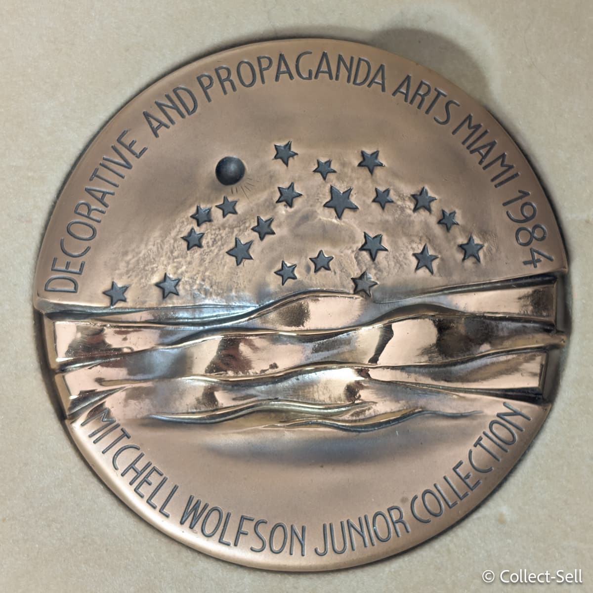 Reverse of bronze medal by Jorio Vivarelli featuring abstract relief design and stars