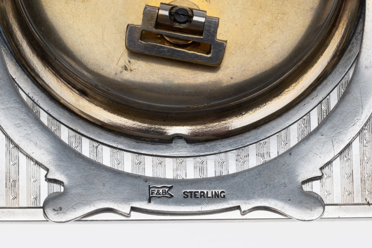 Close-up of F&B Sterling hallmark on back of Foster & Bailey silver guilloché enamel desk clock.