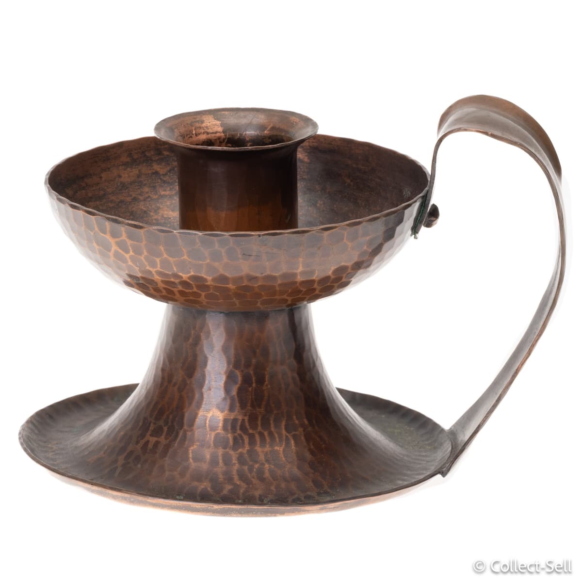 Angled view of hand-hammered Roycroft copper candle holder with loop handle